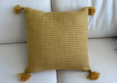 EGF yellow pillow with corner tassels