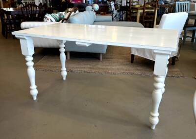 custom table with glued up top and curved legs in farmhouse finish