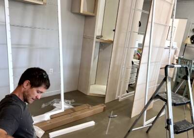 Eric installing a drying rack for small custom laundry room