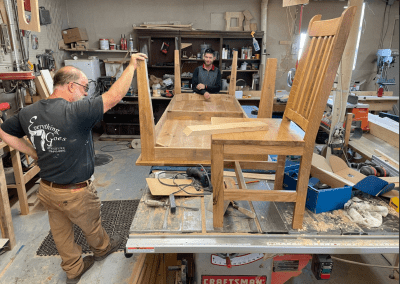 The guys building solid white oak table and chairs